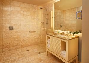 a bathroom with a shower and a sink at Global Hotel Panama in Panama City