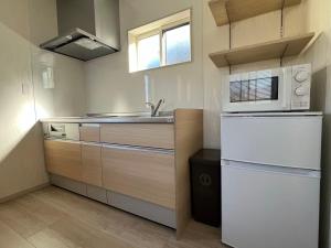 Kuchyň nebo kuchyňský kout v ubytování 富士晴 湖畔 Villas 湖景 + 23 fotografií