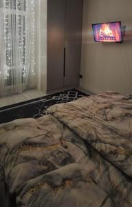 Postel nebo postele na pokoji v ubytování Однокомнатная квартира посуточно + 1 fotografie