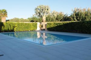 Bazén v ubytování Villetta di Nonna Giovanna nebo v jeho okolí