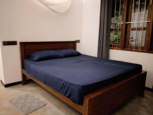 Postel nebo postele na pokoji v ubytování Amandaa Homestay + 12 fotografií