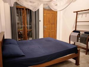 Postel nebo postele na pokoji v ubytování Amandaa Homestay