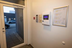 a door leading into a room with a window at New Downtown Retreat in Akureyri