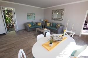 a living room with a couch and a table at Casa Robinson in Guía de Isora