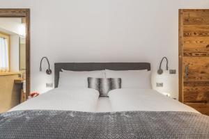 Ένα ή περισσότερα κρεβάτια σε δωμάτιο στο Agriturismo Sicher