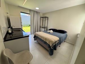 Ένα ή περισσότερα κρεβάτια σε δωμάτιο στο Studio Top no Residencial Porto Mar