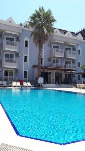 a large swimming pool in front of a building at Amphi Apart in Marmaris