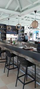 a large counter in a restaurant with two chairs at Amphi Apart in Marmaris