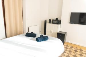 Ένα ή περισσότερα κρεβάτια σε δωμάτιο στο Appartement confort à Rouen +11 φωτογραφίες