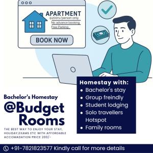 a man sitting in front of a laptop computer at Bachelor's Homestay in Aurangabad