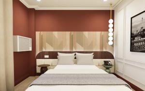 Ένα ή περισσότερα κρεβάτια σε δωμάτιο στο The Maximilian Hotel - Cebu