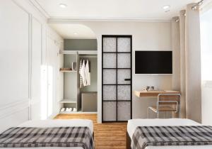 Ένα ή περισσότερα κρεβάτια σε δωμάτιο στο The Maximilian Hotel - Cebu