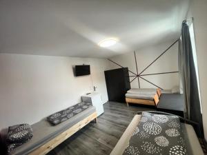 a room with two bunk beds in a room at Pension Baron in Fürth