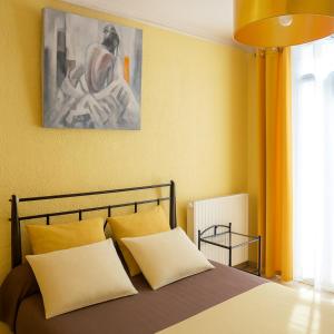 Ένα ή περισσότερα κρεβάτια σε δωμάτιο στο Hôtel Perpignan Centre