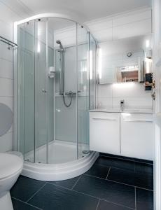 Koupelna v ubytování Kjøbmandsgaarden Hotel + 46 fotografií