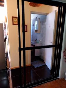 a bathroom with a shower and a sink at La casa de las flores in Las Heras