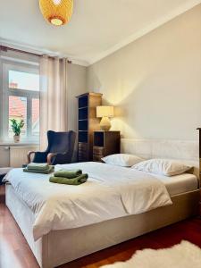 Postel nebo postele na pokoji v ubytování Kawka i herbatka