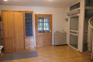 a room with a door and a chalkboard on the wall at Ferienhaus in der Trift in Winsen