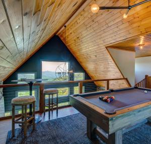 a room with a pool table in a house at Owls Nest in Seven Devils