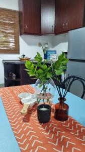 a kitchen table with two potted plants on it at Agulhas Stay in Agulhas