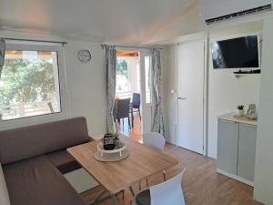 a living room with a table and a couch at #757 Status Relax No Stress in Biograd na Moru