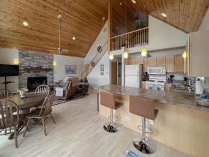 a kitchen and living room with a table and chairs at Amazing Views Fire Pit & Grill near Wardensville in Delray +21 photos