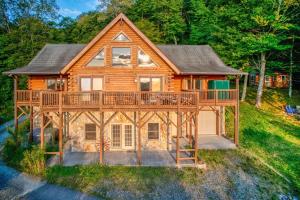 a large wooden house with a large deck at Sugar Bear Lodge in Banner Elk