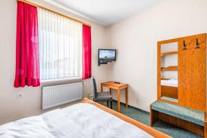Postel nebo postele na pokoji v ubytování Hotel Pension Fruth