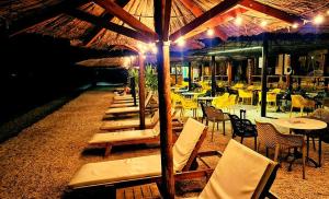 a row of tables and chairs in a restaurant at #757 Status Relax No Stress in Biograd na Moru