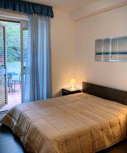 Ένα ή περισσότερα κρεβάτια σε δωμάτιο στο Appartamento fronte mare Taormina - relax e posizione top