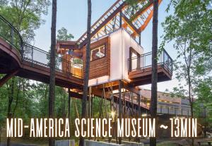 a tree house in the middle of the forest at Chic Downtown Retreat Fireplace Game Area in Hot Springs