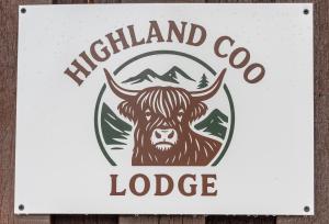 a sign for a highland cow lodge at Highland Coo Lodge in Dunoon