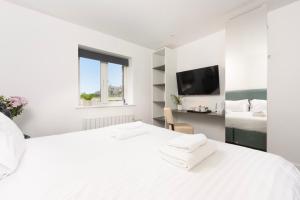 Voodi või voodid majutusasutuse Cape Cornwall Club toas