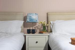 Voodi või voodid majutusasutuse Cape Cornwall Club toas