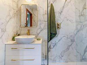 a white bathroom with a sink and a mirror at 6 Bed in Stanley 96289 in Stanley +52 photos