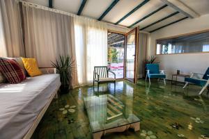 a living room with a couch and a glass table at Apartments Rux de Luxe in Bar +50 photos