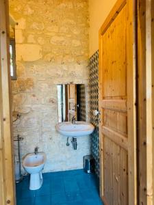 a bathroom with two sinks and a window and a door at Casa Betta in Modica +63 photos