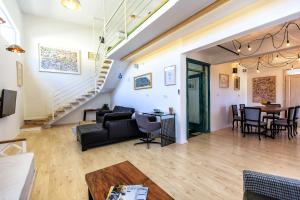a living room with a couch and a table at Apartments Rux de Luxe in Bar