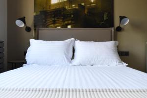 Кровать или кровати в номере 4 Seasons Luxury Apartments