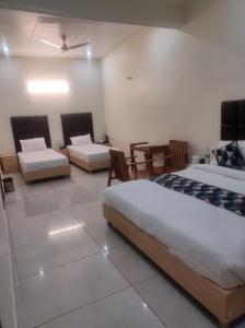 Postel nebo postele na pokoji v ubytování Great Tiger Resort