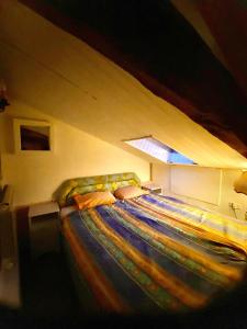 a bedroom with a large bed in a attic at Vojko Holidays in Koper