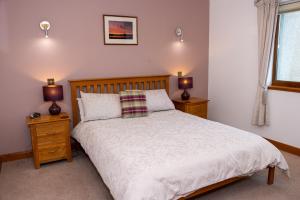 Postel nebo postele na pokoji v ubytování Avalon Guest House