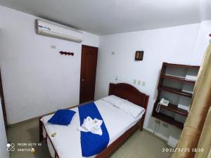 Ένα ή περισσότερα κρεβάτια σε δωμάτιο στο anyros plaza hotel