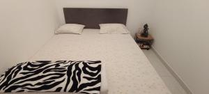 Ένα ή περισσότερα κρεβάτια σε δωμάτιο στο Casa Azul