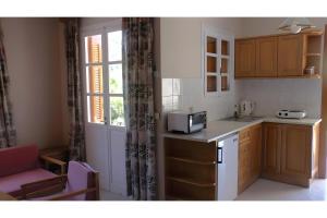 Kuchyň nebo kuchyňský kout v ubytování Captain's Dion Apartments