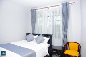 Ένα ή περισσότερα κρεβάτια σε δωμάτιο στο Fahari Cedar House