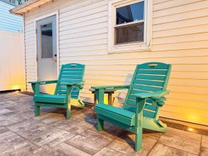 two chairs and a table on a patio at Heron Hideaway Game Room within walking distance to HWS & Seneca Lake in Geneva