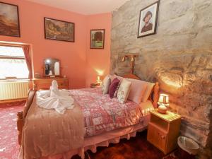 Postel nebo postele na pokoji v ubytování Coole Gate Lodge