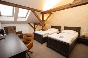 Ένα ή περισσότερα κρεβάτια σε δωμάτιο στο Apartmány na Bašte