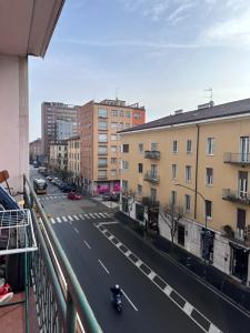 a view of a city street with a motorcycle on the road at Solferino 17 suites Brescia Stazione in Brescia